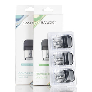 Smok - Novo 2 - Replacements Pods - Mesh 1.0ohm and DC 1.4ohm tall white boxes with a strip of 3 pods standing beside them.